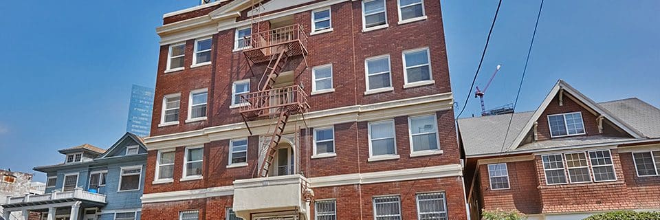 A fire escape on the side of an apartment building.